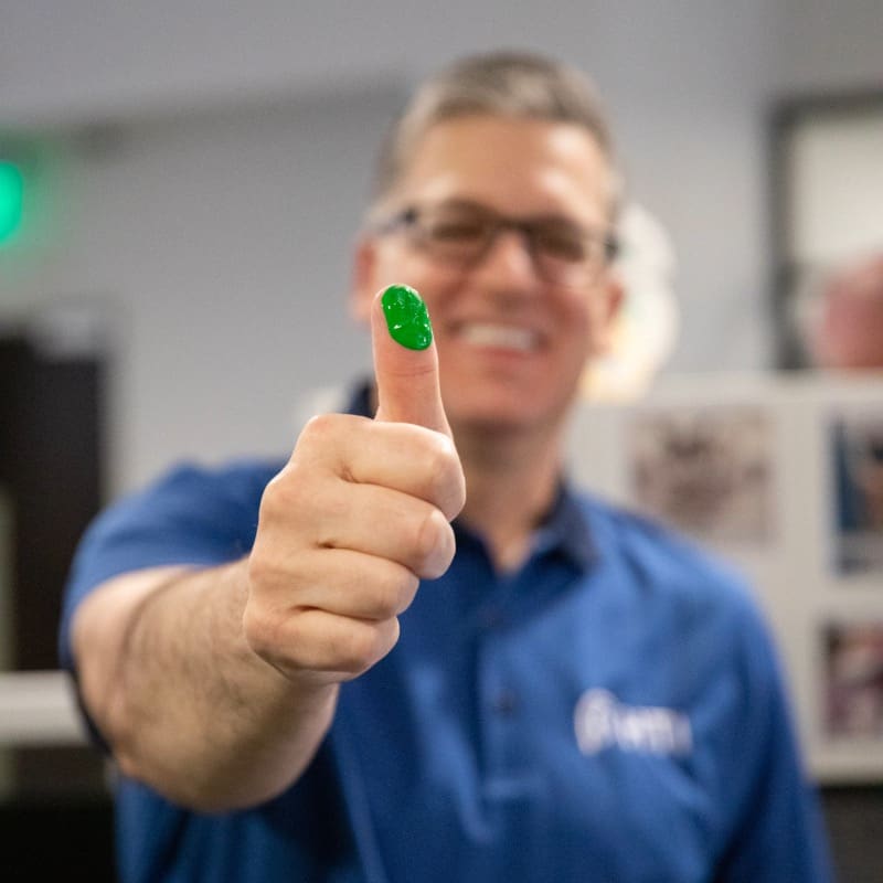 HTI employee with green fingerprint